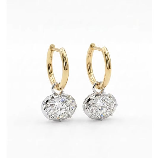 Hailey earrings: 925 sterling silver oval drop earrings with baguette, round and marquise 5A cubic zirconia stones on a huggie hoop